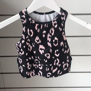 Strut this blush leopard sports bra